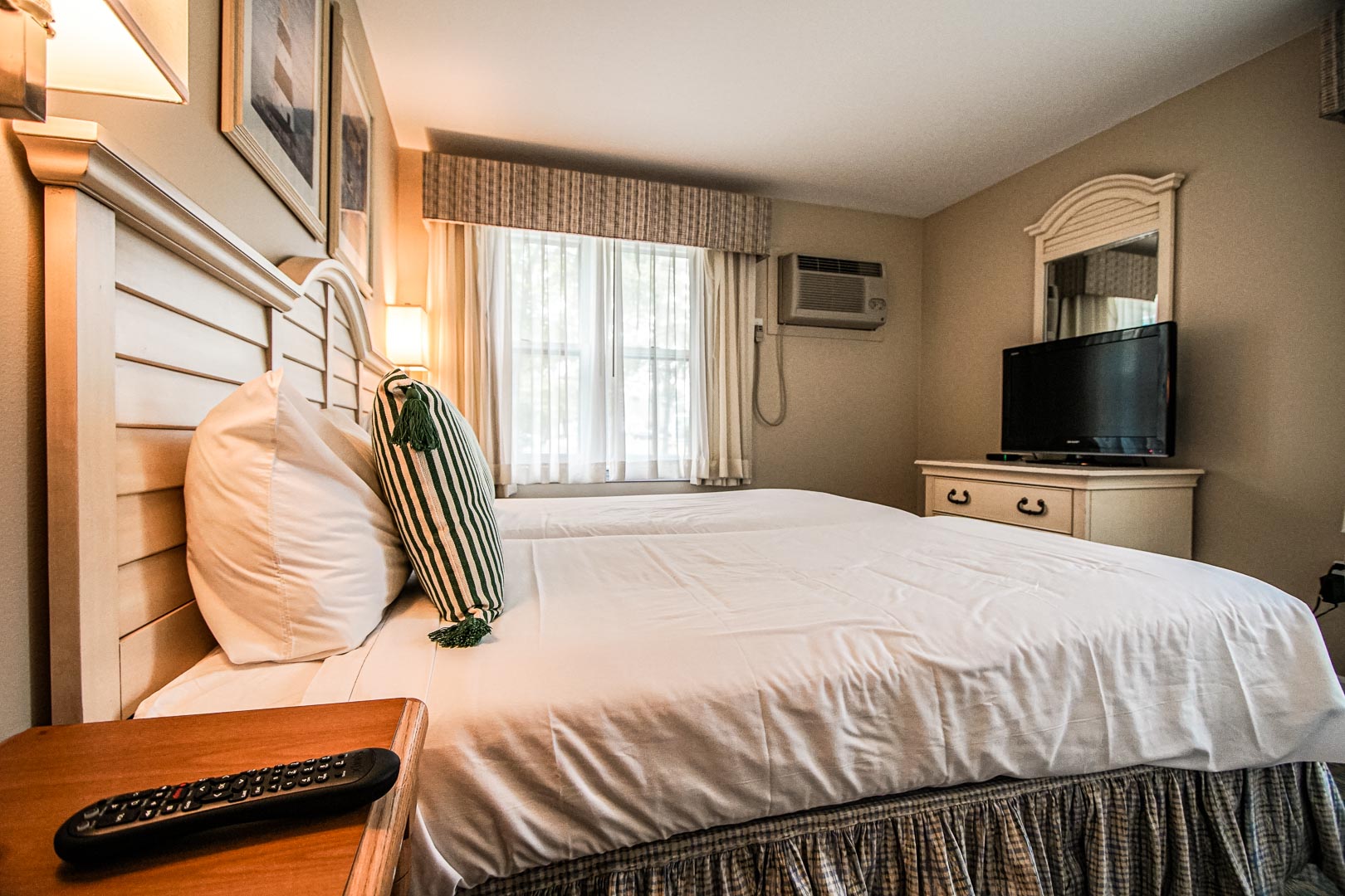 A crisp master bedroom at VRI's Cape Winds Resort in Massachusetts.